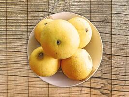 oranges on wooden background photo