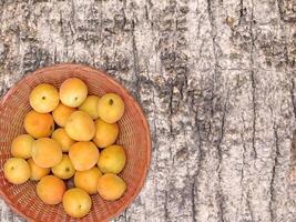 Apricots On The Wooden Background photo