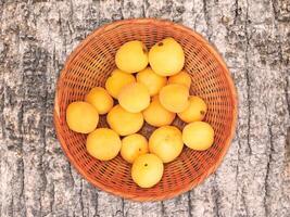 Apricots On The Wooden Background photo