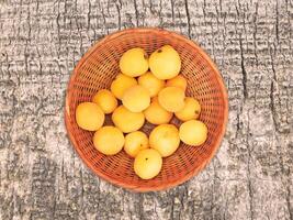 Apricots On The Wooden Background photo