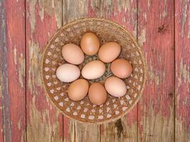 Eggs On The Wooden Background photo