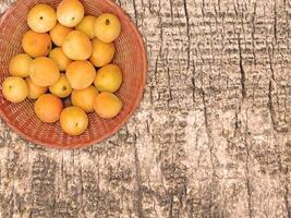 Apricots On The Wooden Background photo