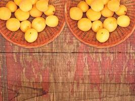 Apricots On The Wooden Background photo