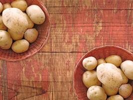 Potatoes On The Wooden Background photo