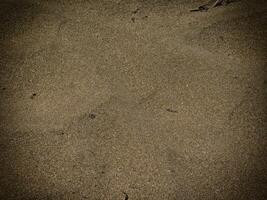 Texture Of Dark Sand At The Sea photo