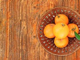 oranges on wooden background photo