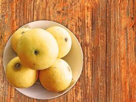 oranges on wooden background photo