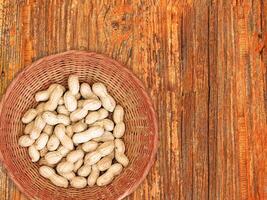 Peanuts On The Wooden Background photo