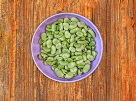 Broad Beans On Wooden Background photo