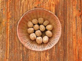 Nuts On The Wooden Background photo