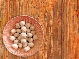 Nuts On The Wooden Background photo