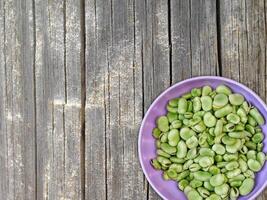 Broad Beans On Wooden Background photo