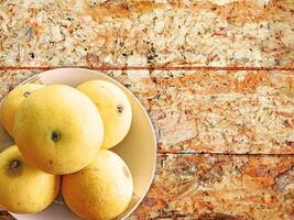 oranges on wooden background photo