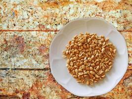 Peanuts On Wooden Background photo