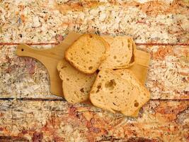 Bread On Wooden Background photo