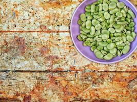 Broad Beans On Wooden Background photo