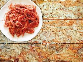 Shrimp On Wooden Background photo