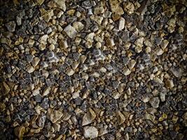 textura de piedra oscura en el jardín foto