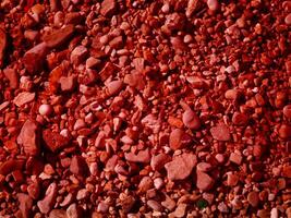 textura de piedra roja en el jardín foto