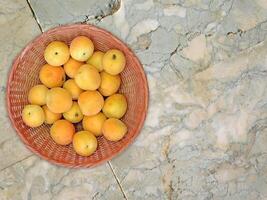 Apricots On Marble Background photo