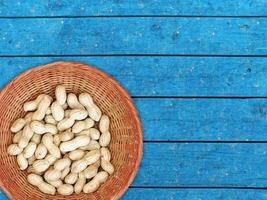 Peanuts On The Wooden Background photo