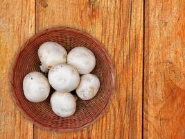 Mushrooms On The Wooden Background photo