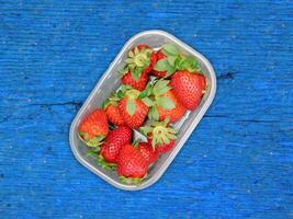 Strawberries On Wooden Background photo