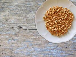 Peanuts On Wooden Background photo