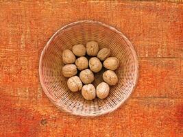 Nuts On The Wooden Background photo