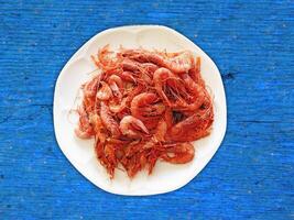 Shrimp On Wooden Background photo