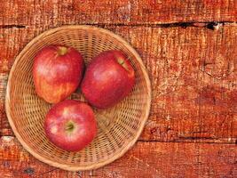 Apples On The Wooden Background photo