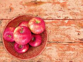 Apples On The Wooden Background photo