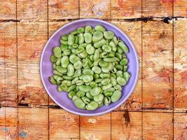 Broad Beans On Wooden Background photo