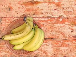 Bananas On The Wooden Background photo