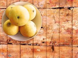 oranges on wooden background photo