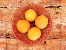 oranges on wooden background photo