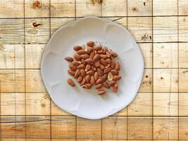 Almonds On Wooden Background photo