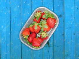 Strawberries On Wooden Background photo