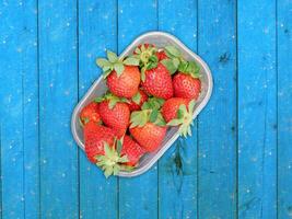 Strawberries On Wooden Background photo