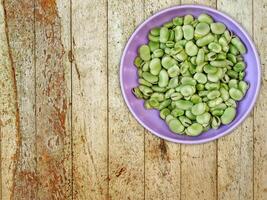 Broad Beans On Wooden Background photo