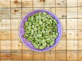 Broad Beans On Wooden Background photo