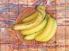 Bananas On The Wooden Background photo