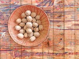 Nuts On The Wooden Background photo