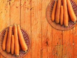 Carrots On The Wooden Background photo