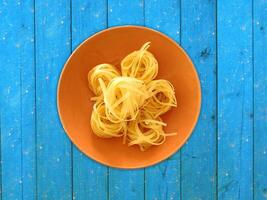 Pasta On Wooden Background photo