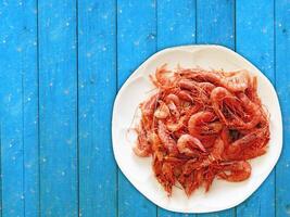 Shrimp On Wooden Background photo