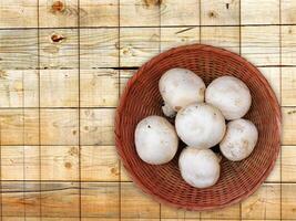 Mushrooms On The Wooden Background photo