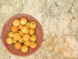 Apricots On Marble Background photo