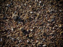 Texture Of Dark Sand At The Sea photo