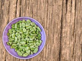 Broad Beans On Wooden Background photo